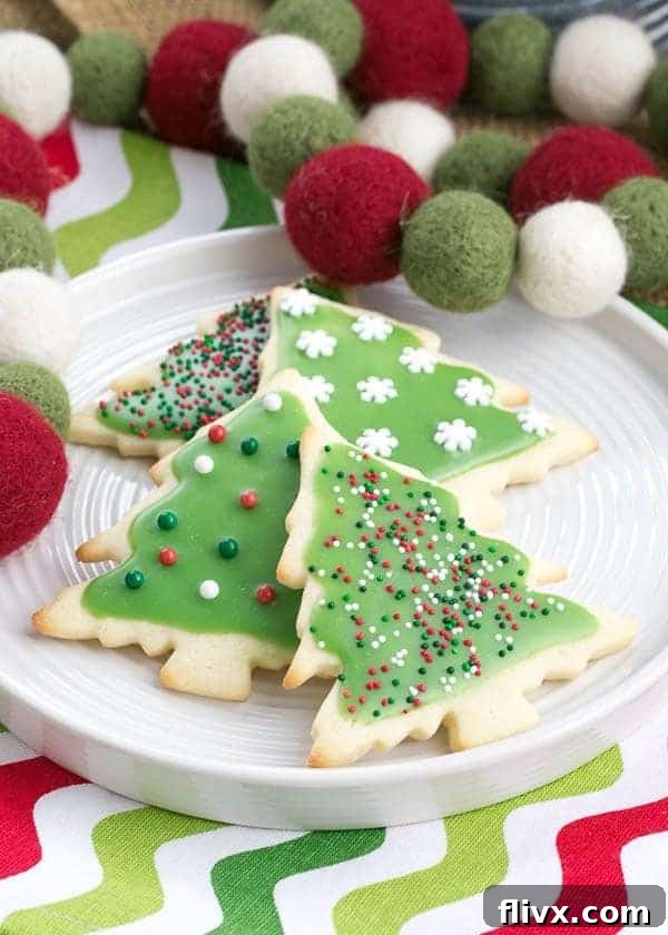Best Sugar Cookies on a white plate on a Christmas napkin with holiday felt garland