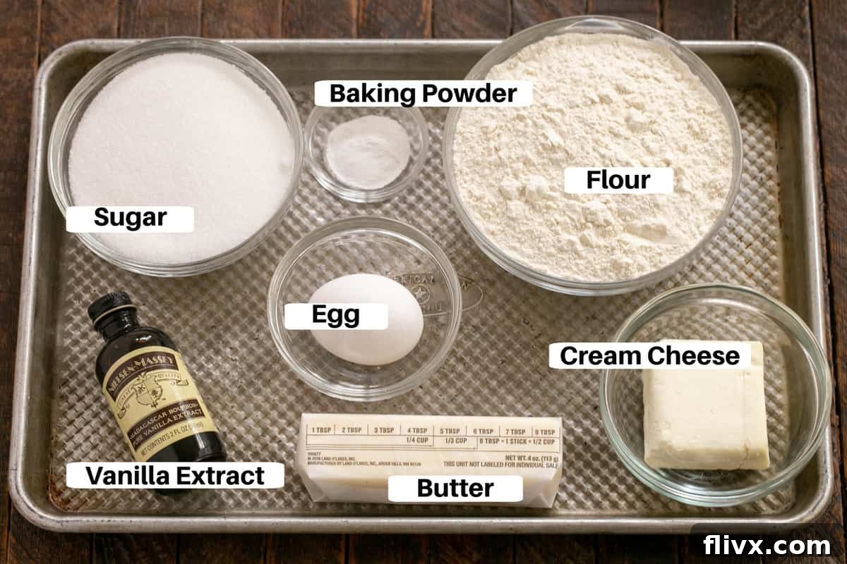 Sugar Cookie Ingredients with labels on a metal sheet pan.
