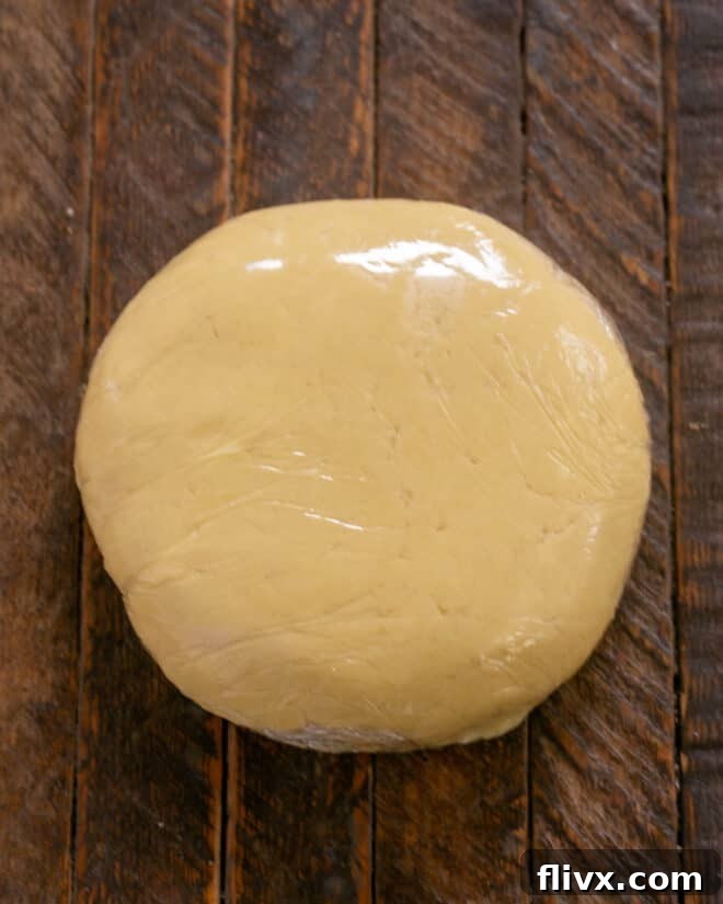 Dough wrapped in plastic.