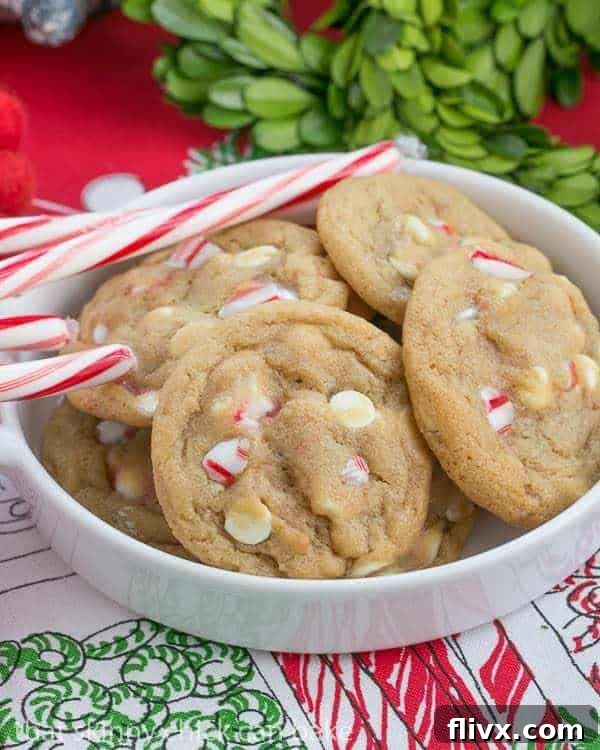 Candy Cane Crunch White Chocolate Delights 2 White Chocolate Candy Cane Cookies: A close-up view of the perfectly baked, chewy cookies filled with white chocolate chips and crushed candy canes, ready to be enjoyed.