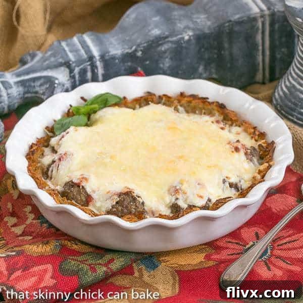 Italian Poutine Pie in a white ceramic pie plate, ready to be served.