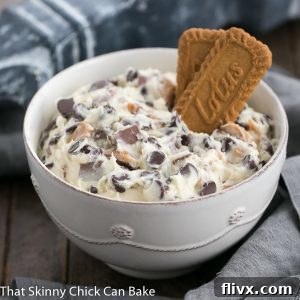 Close-up of a serving of Chocolate Chip Cookie Dough Dip, showing its creamy texture and visible chocolate and toffee pieces, ready to be enjoyed.