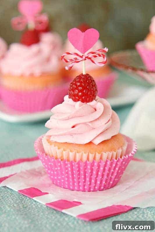 Vibrant Pink Velvet Raspberry Cupcakes.
