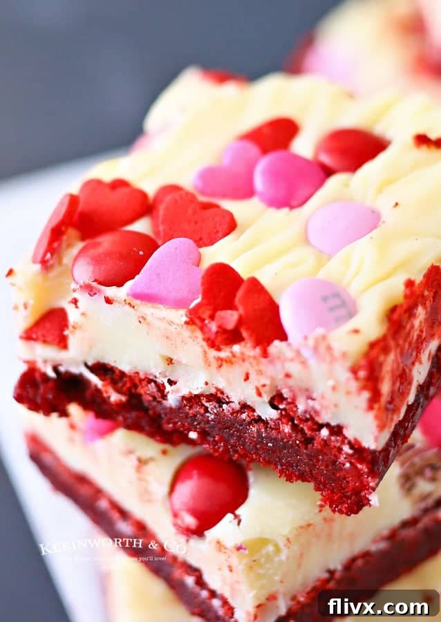 Festive Valentine Red Velvet Brownies with frosting and sprinkles.
