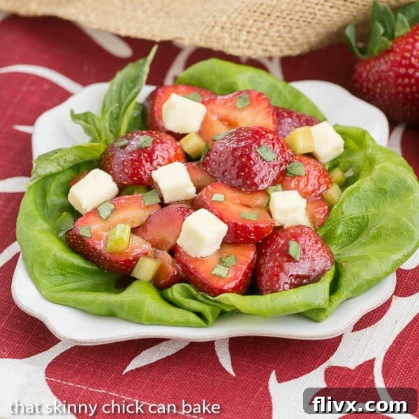 Close-up of Basil Brie and Strawberry Salad on a white plate