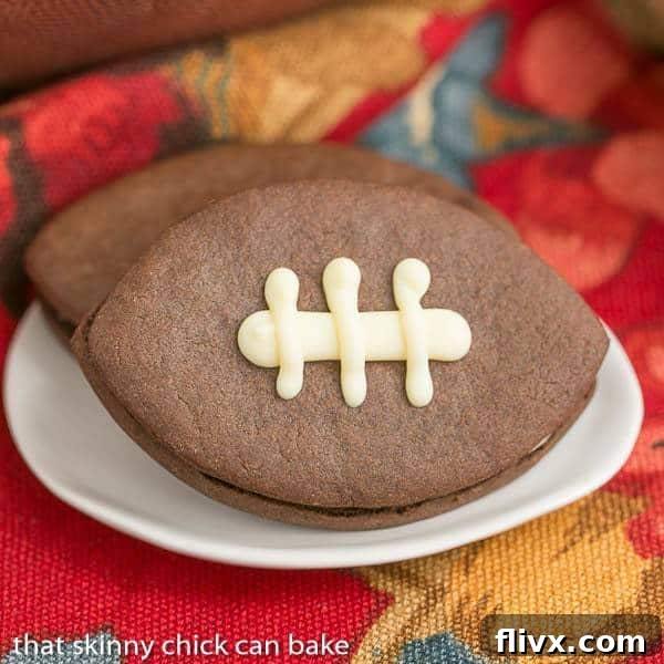 Chocolate Football Cookies | Chocolate cut-out cookies filled with buttercream and caramel, a delightful game day dessert!