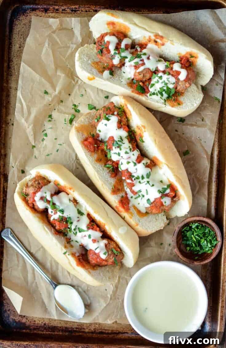 Slow Cooker Meatball Subs with Parmesan and White Cheddar Queso