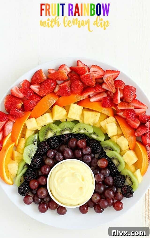 A vibrant Fruit Rainbow with a tasty lemon dip, perfect for healthy spring entertaining.