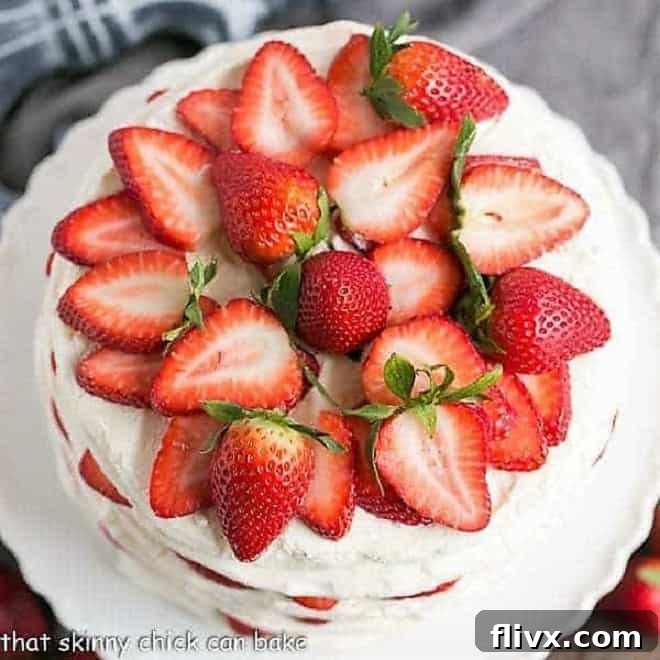 Elegant Fresh Strawberry Meringue Cake with layers of crispy meringue and mascarpone cream.