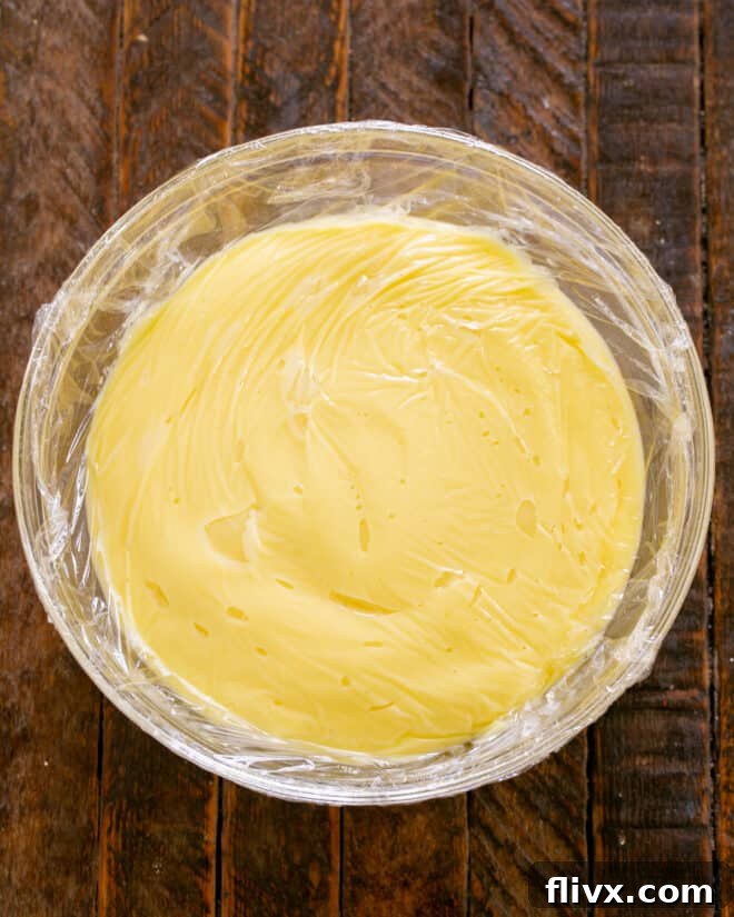 Step 9: Scrape into bowl, press plastic wrap over surface and chill 4+ hours.