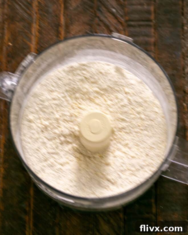 Step 2: Pulse to mix butter, then egg. Process to form dough.