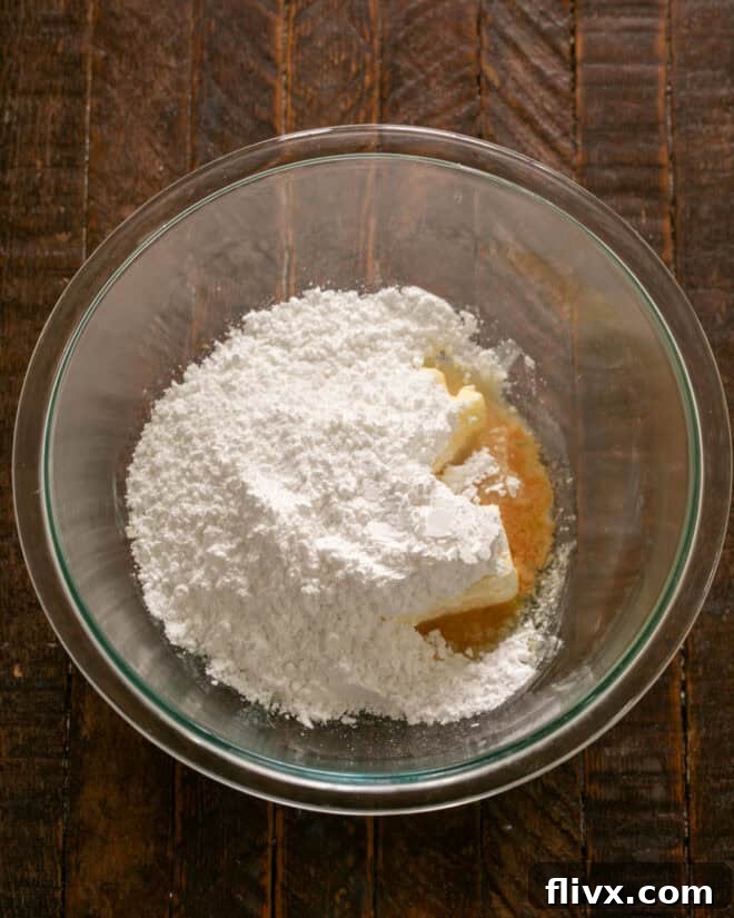 Step 4: Mixing together butter, cream cheese, powdered sugar, milk, vanilla and salt for the frosting.