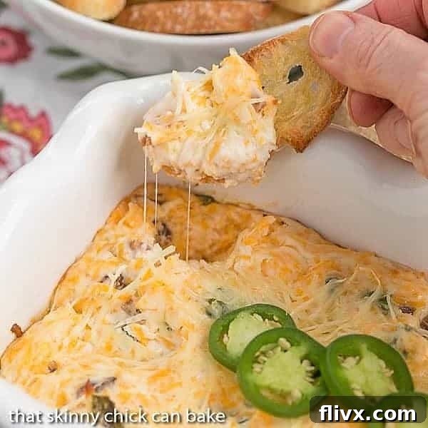 Jalapeno Popper Dip served on toasted crostini, with fresh jalapeno slices