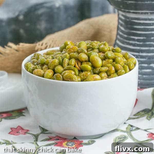 Roasted Creole Edamame in a white bowl, ready to be enjoyed as a healthy snack or appetizer.