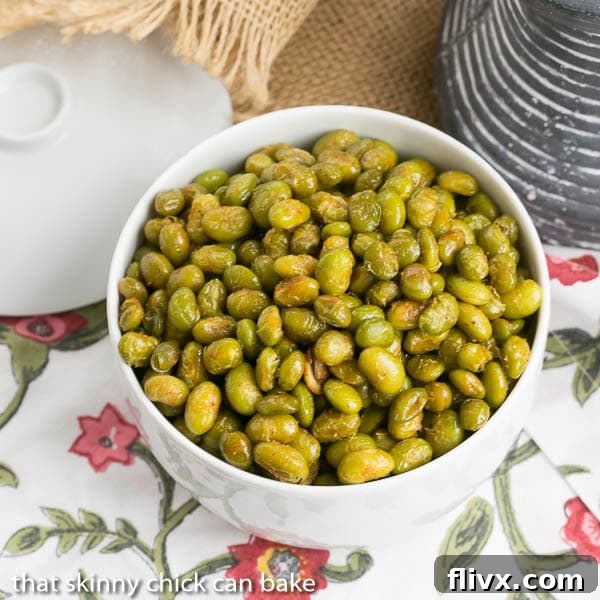 Roasted Creole Edamame in a white bowl viewed from above, showcasing its vibrant green color and appealing seasoning.