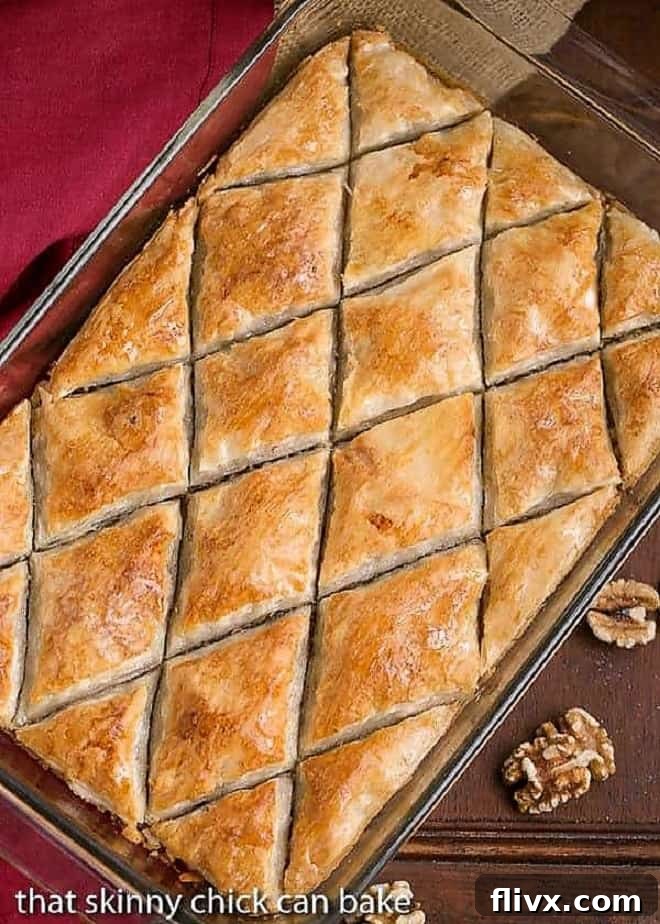 Overhead view of Classic Greek Baklava cut into diamond shapes in a glass 9x13-inch pan, ready to be served