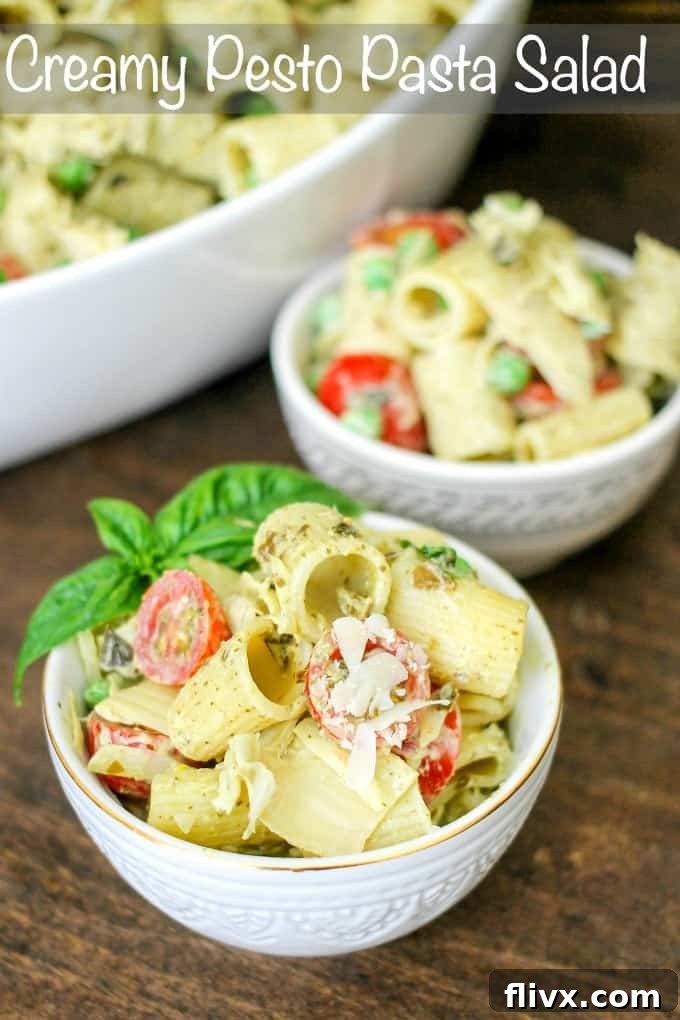 Creamy Pesto Pasta Salad loaded with delicious ingredients, perfect for picnics or BBQs.