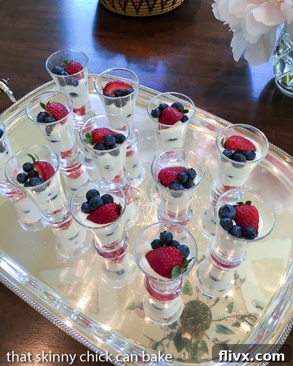 White Chocolate Berry Parfaits on a silver tray, ready to be served