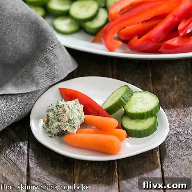 Refreshing Sour Cream Spinach Dip served with fresh vegetables for dipping.