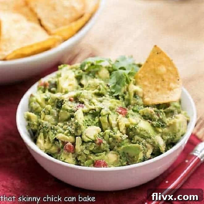 Classic Guacamole recipe, freshly prepared with vibrant green avocados and seasonings.
