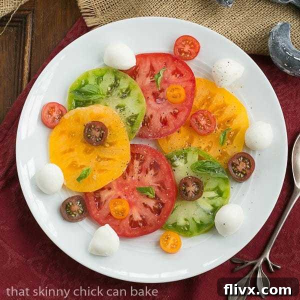 Salade de Tomates et Fromage (Caprese) featuring fresh ripe tomatoes and mozzarella.