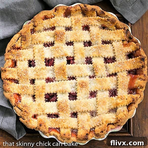 An inviting overhead view of a beautifully baked Classic Rhubarb Pie in a ceramic pie plate, showcasing its golden lattice and bubbly filling.