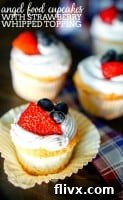 Light Angel Food Cupcakes with Strawberry Whipped Topping, airy and garnished with fresh strawberries.