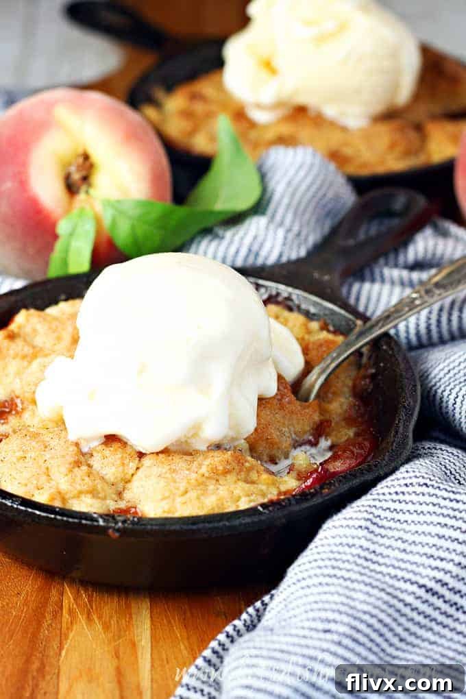 An Old Fashioned Peach Cobbler, bubbling with fresh peaches and a golden-brown cobbler topping.