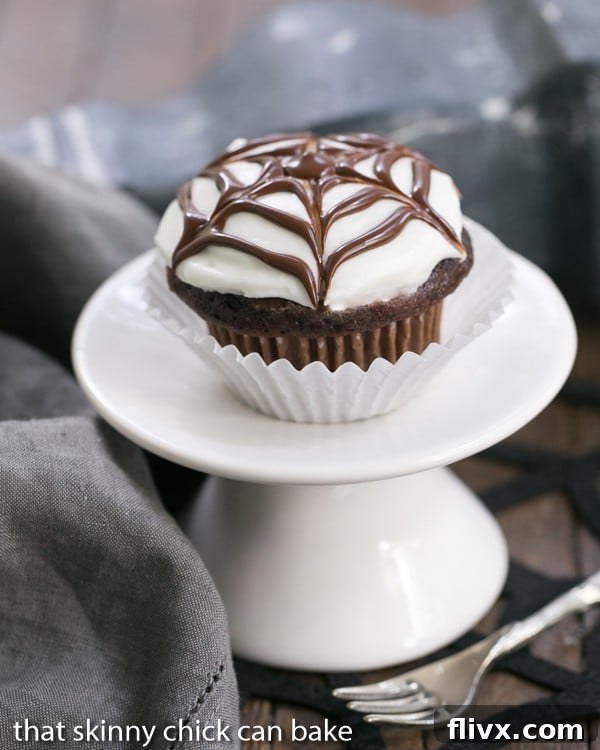 Spiderweb Cupcake on a white pedestal