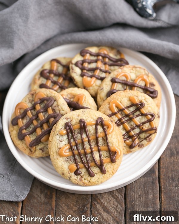 Toffee Cookies on a white plate, drizzled with caramel and chocolate