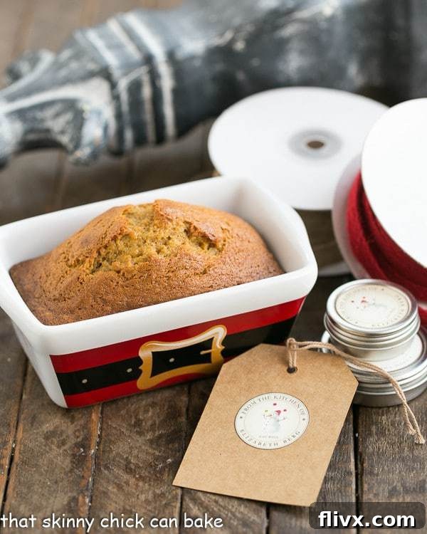 Beautifully arranged mini pumpkin breads with festive gift wrapping supplies, perfect for holiday gifting.