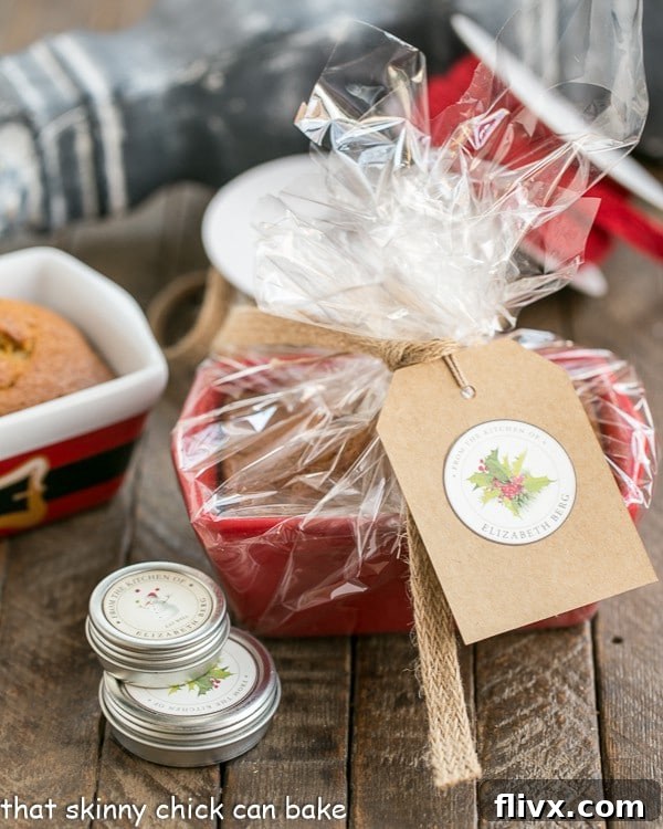 Thoughtfully wrapped mini pumpkin bread, adorned with cellophane and a festive gift card, ready to be presented.
