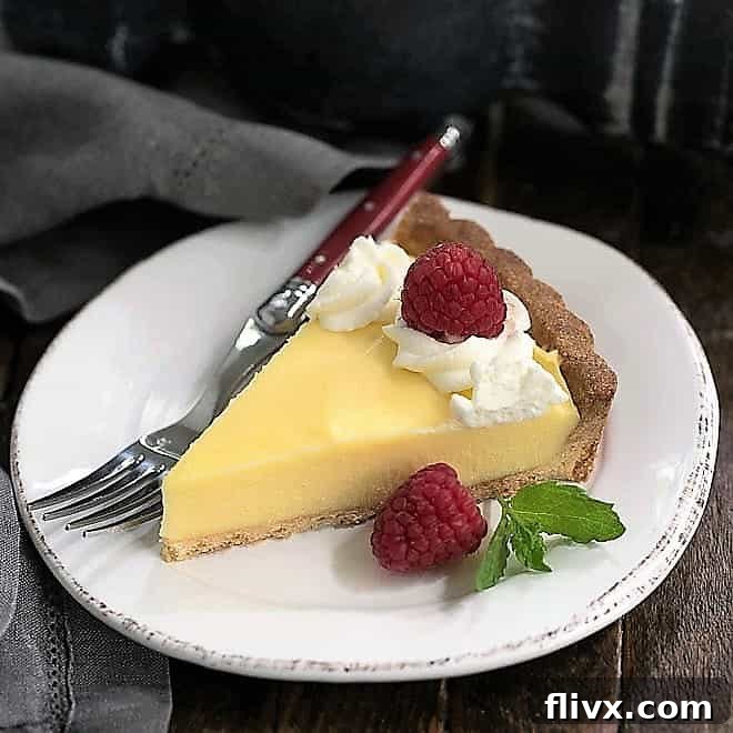 Bright and zesty Creamy Lemon Tart, showcasing a smooth lemon filling in a delicate crust.