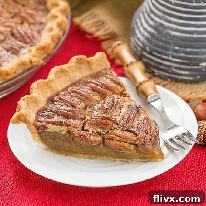 Rich Bourbon Pecan Pie with a shiny, nutty topping and a buttery crust, perfect for Thanksgiving.