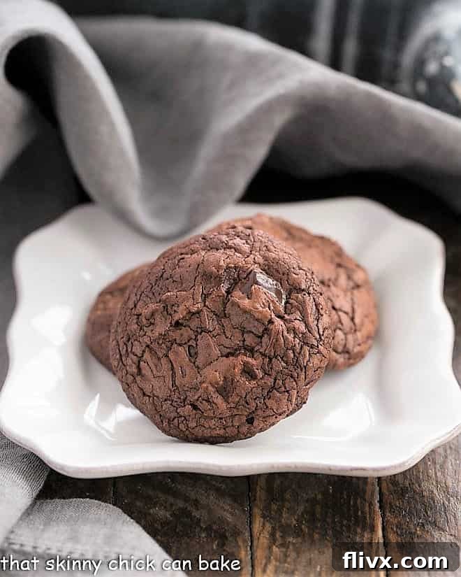 Black Gold Cookies on a small white plate, showing a rich, dark color and soft interior