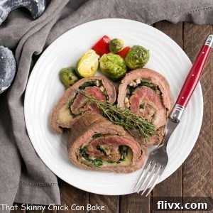 Top-down view of a single Flank Steak Roulade, showcasing the rich brown exterior and vibrant green and white interior.