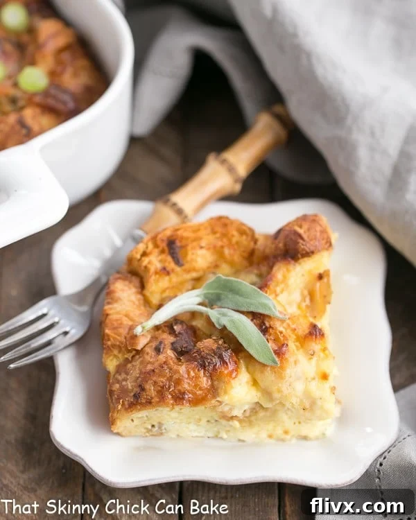 Sausage Croissant French Toast Casserole serving on a small white plate.