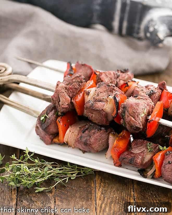 Greek Marinated Lamb Kebabs on a white serving tray