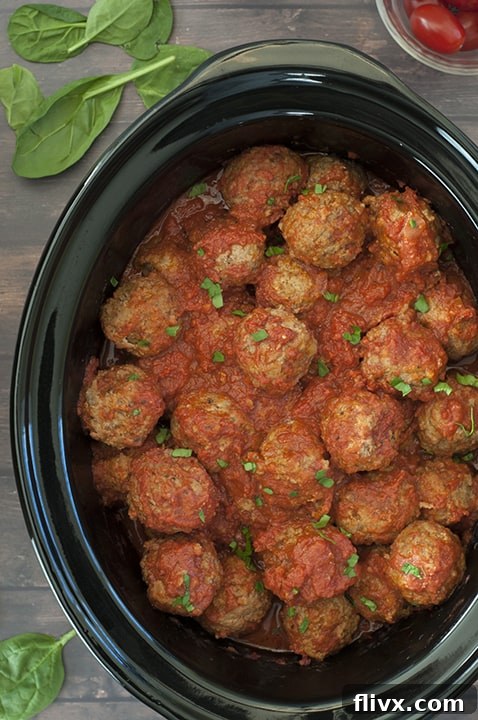 Crock Pot Italian Meatballs, simmering in sauce.