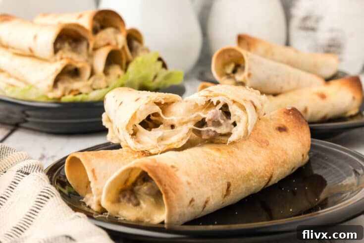 Crispy Philly Cheesesteak Taquitos with dipping sauce.