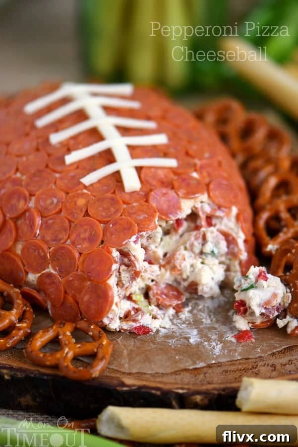 Pepperoni Pizza Football Cheese Ball, shaped like a football.