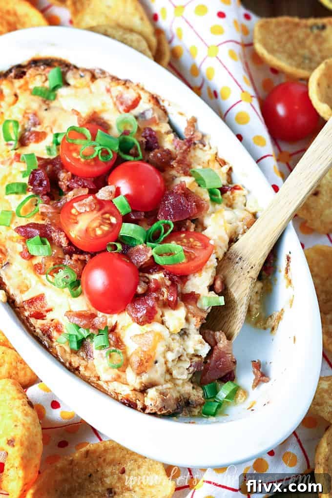 Warm and cheesy Baked BLT Dip in a skillet.