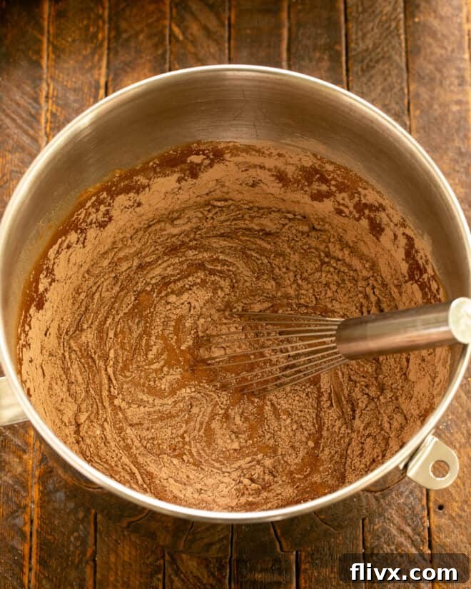 Whisking the cake batter until just combined.