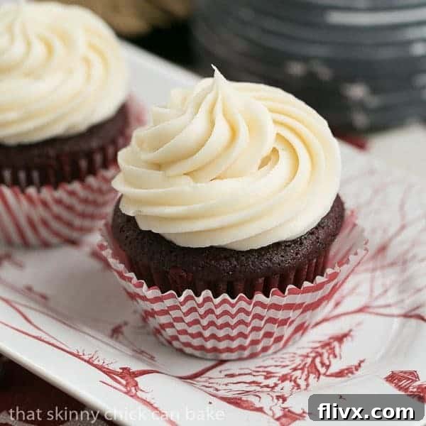 Classic red velvet cupcakes topped with a swirl of cream cheese frosting.