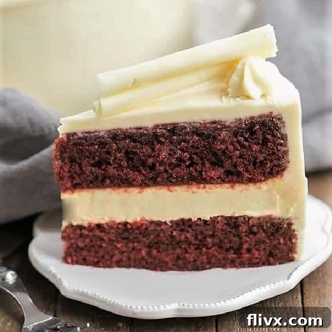 A stunning red velvet cake with a creamy cheesecake layer baked inside.
