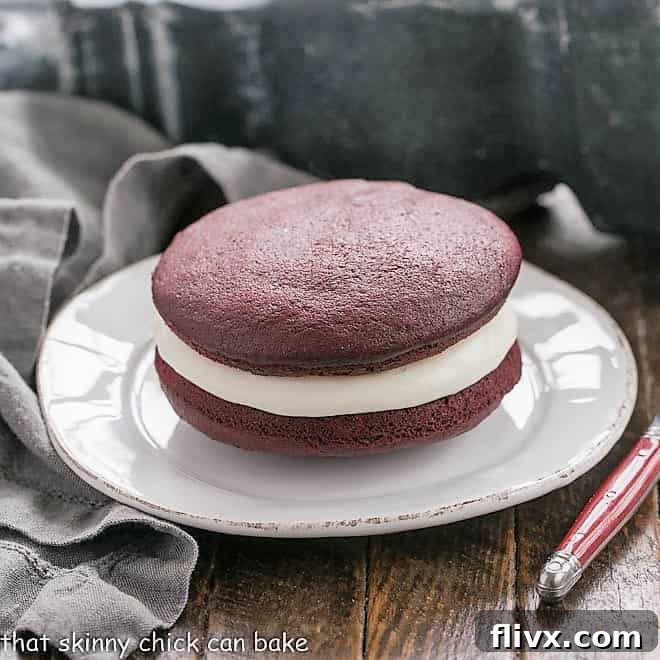 Red velvet whoopie pies filled with a fluffy marshmallow creme frosting.