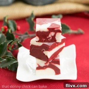 Scrumptious red velvet fudge made with white chocolate, cut into squares.