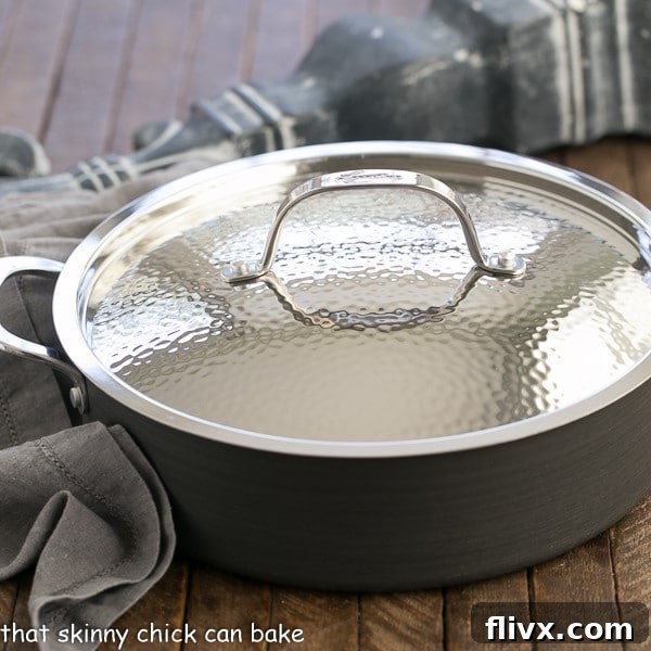 Lagostina Nera 5-quart nonstick casserole, perfect for large family meals. A dark, round Lagostina Nera nonstick casserole pan with a hammered stainless steel lid.