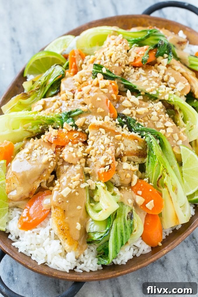 Plated Thai Peanut Chicken with fresh herbs