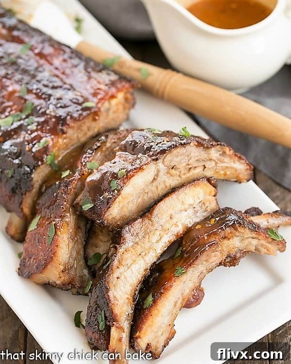 Succulent Apricot Glazed Baby Back Ribs piled high on an elegant platter, garnished and ready for a feast